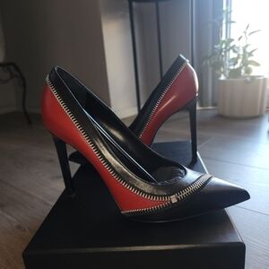 Saint Laurent Red and Black leather zipper pointed stiletto pumps.